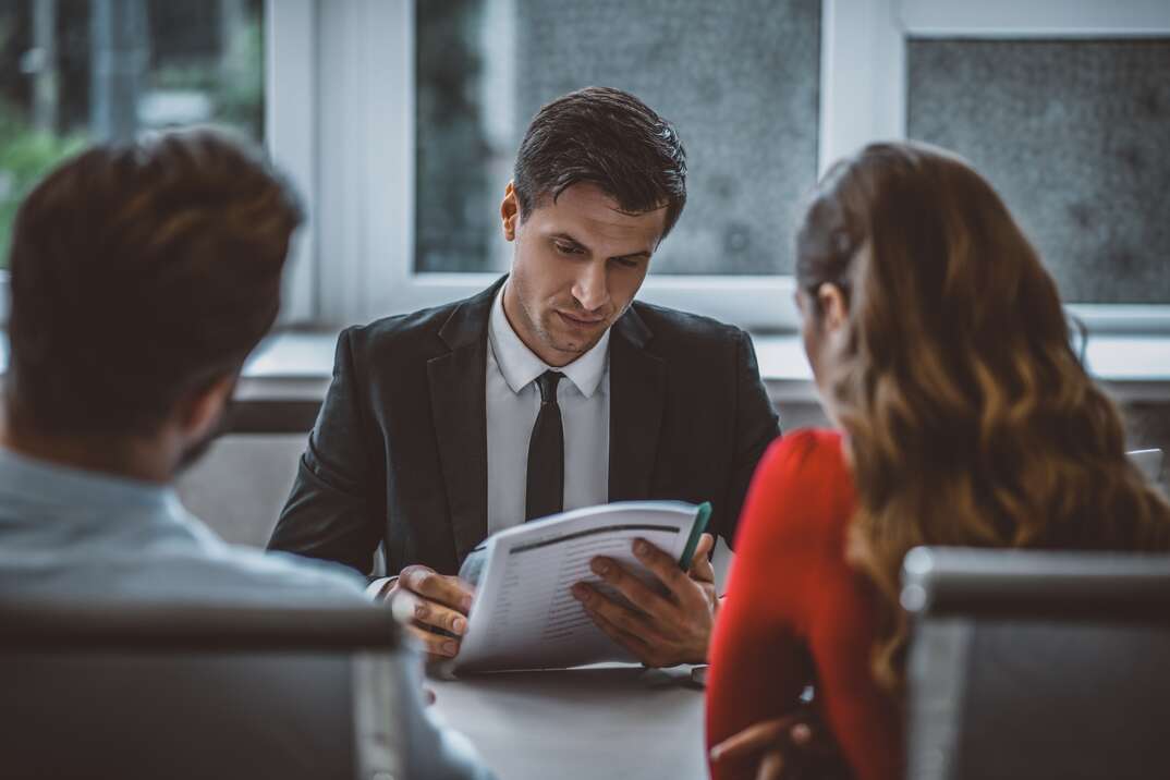 Legal consultancy. A man and a woman sitting at the lawyers office