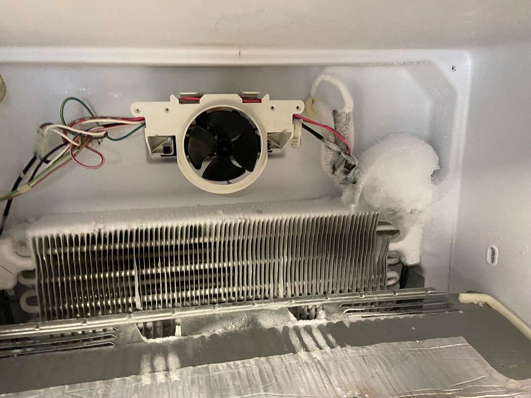 Fan door clears shop air