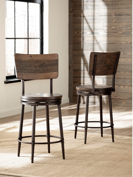 Two wooden and metal stools in a bright room