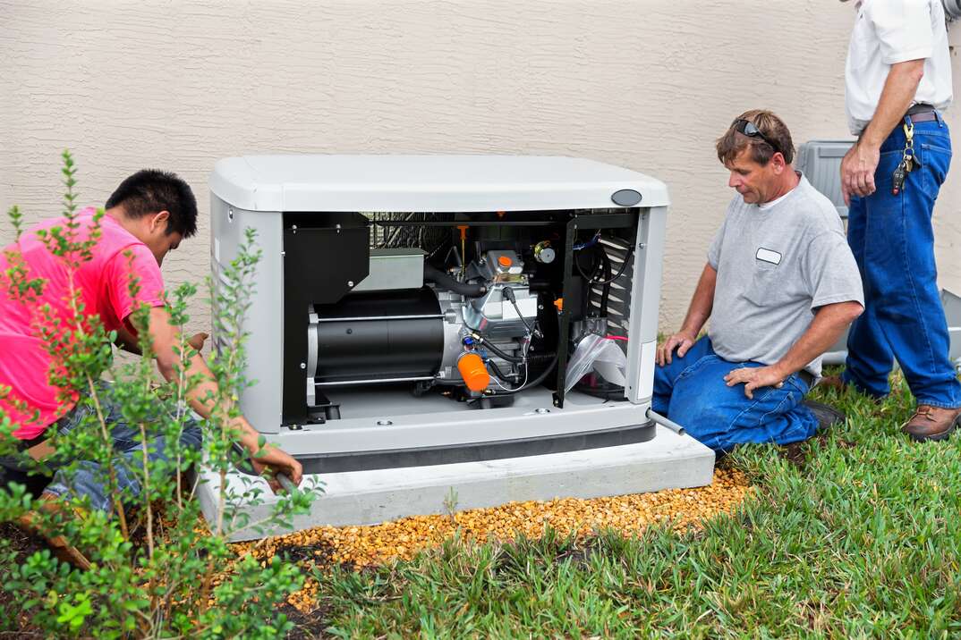 technician checking external HVAC unit