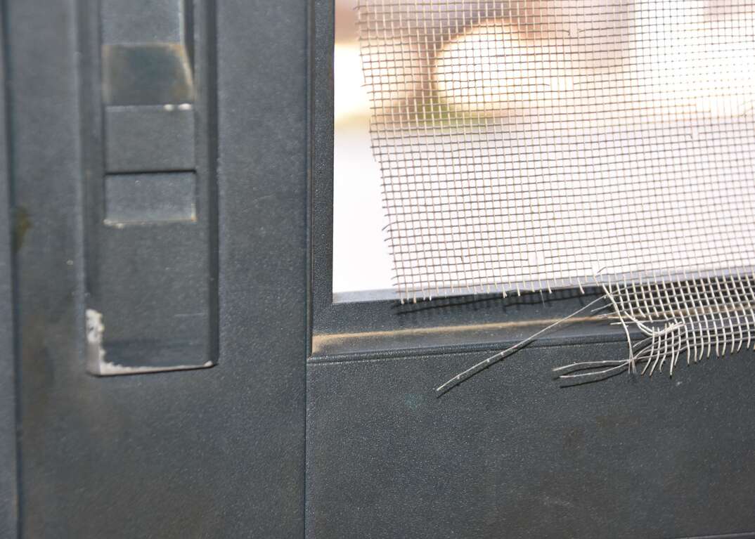 Damaged screen door