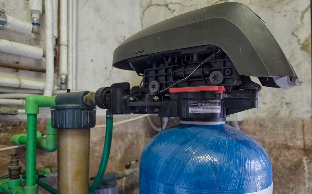 close up of a blue residential water softener