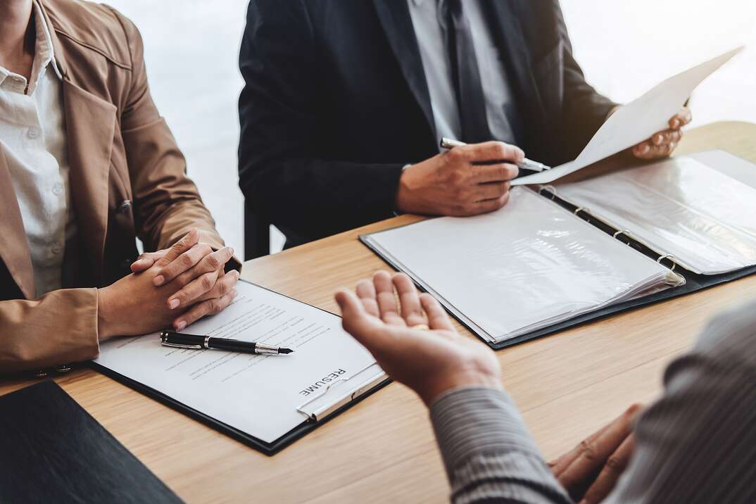 Business man explaining about his profile to two senior manager sitting in during job Interview, interview the job and hiring.