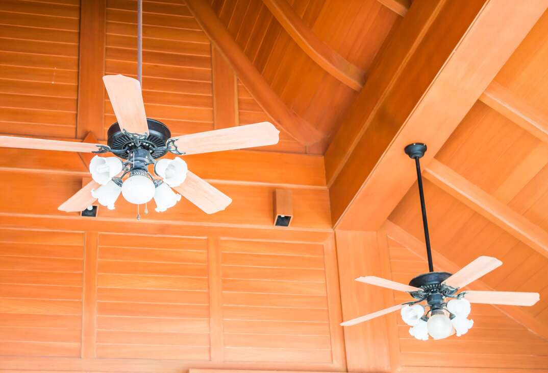 Old style wood ceiling fans with white glass lamps