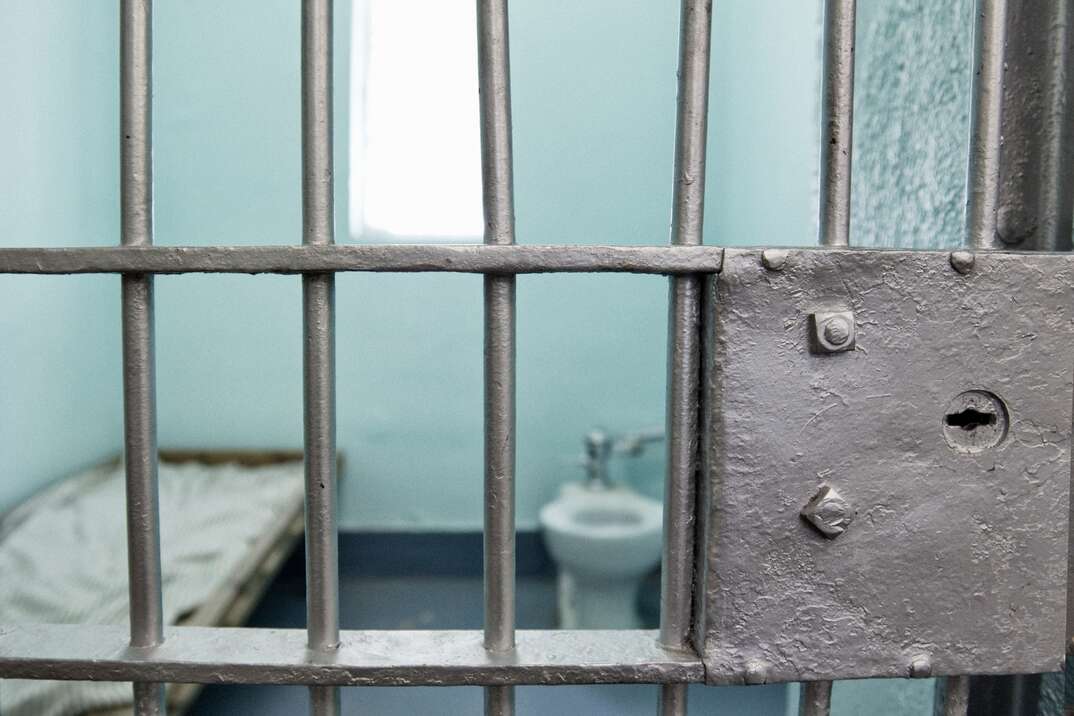 Jail cell with selective focus on bars.