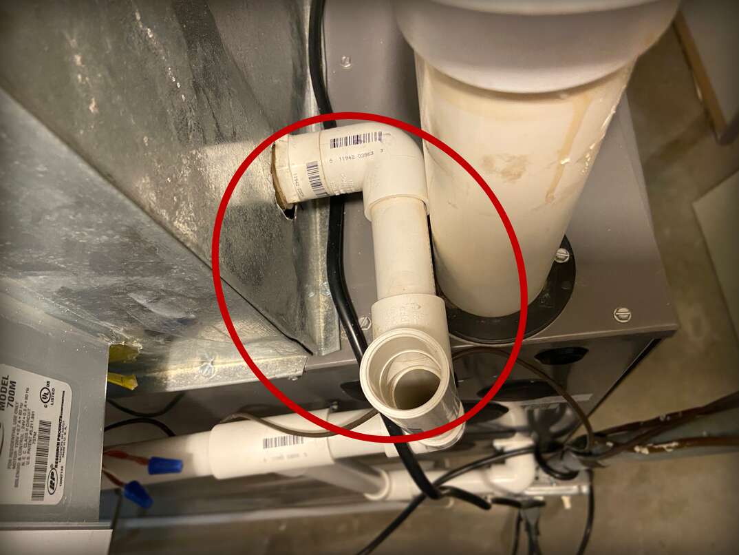 pvc pipe being used as a condensation drain for an air conditioner