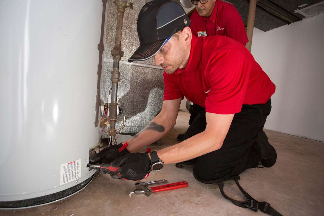 technician with water heater