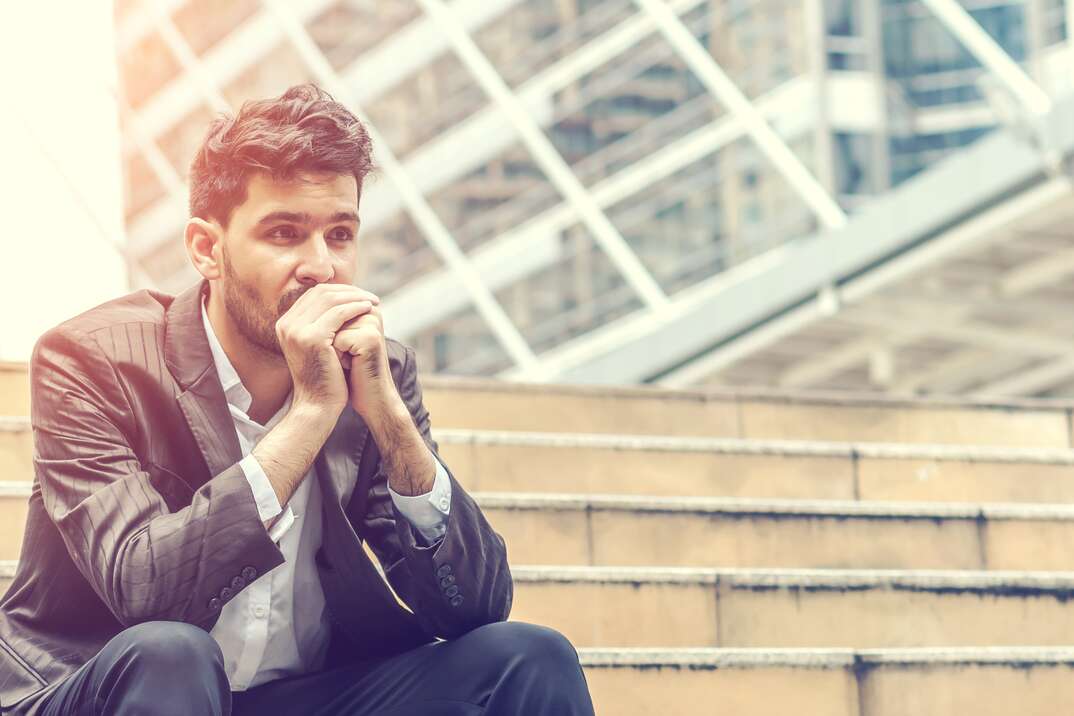 Unemployed businessman stress sitting on stair concept of business failure and unemployment problem work life balance image processing instagram vintage color.