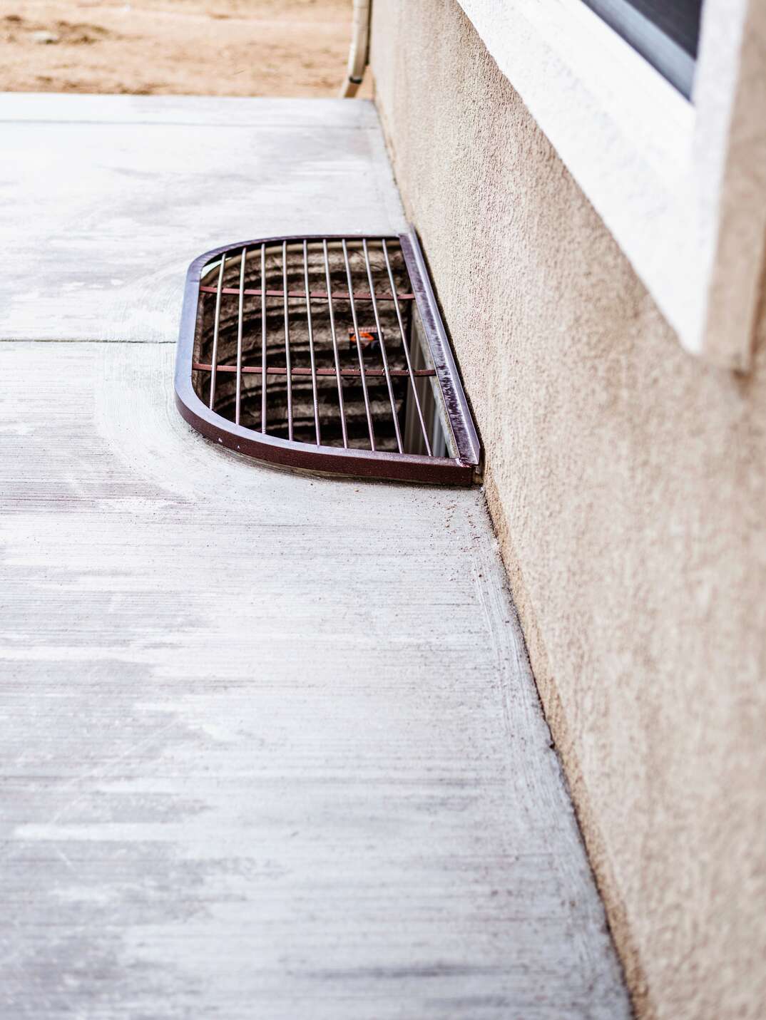 Basement window well with steel safety cover  New home construction