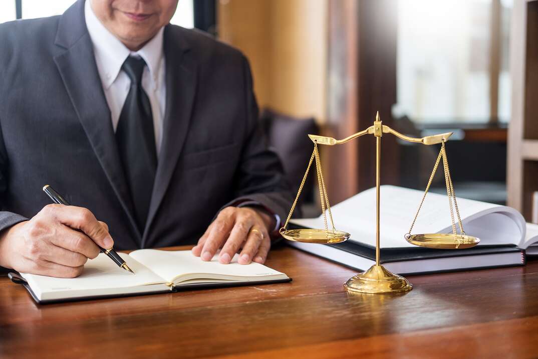 The private office workplace for consultant an young lawyer legislation with gavel and document on wood table