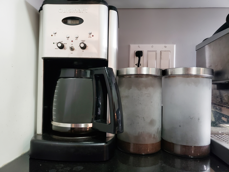 Coffee pot and containers on counter