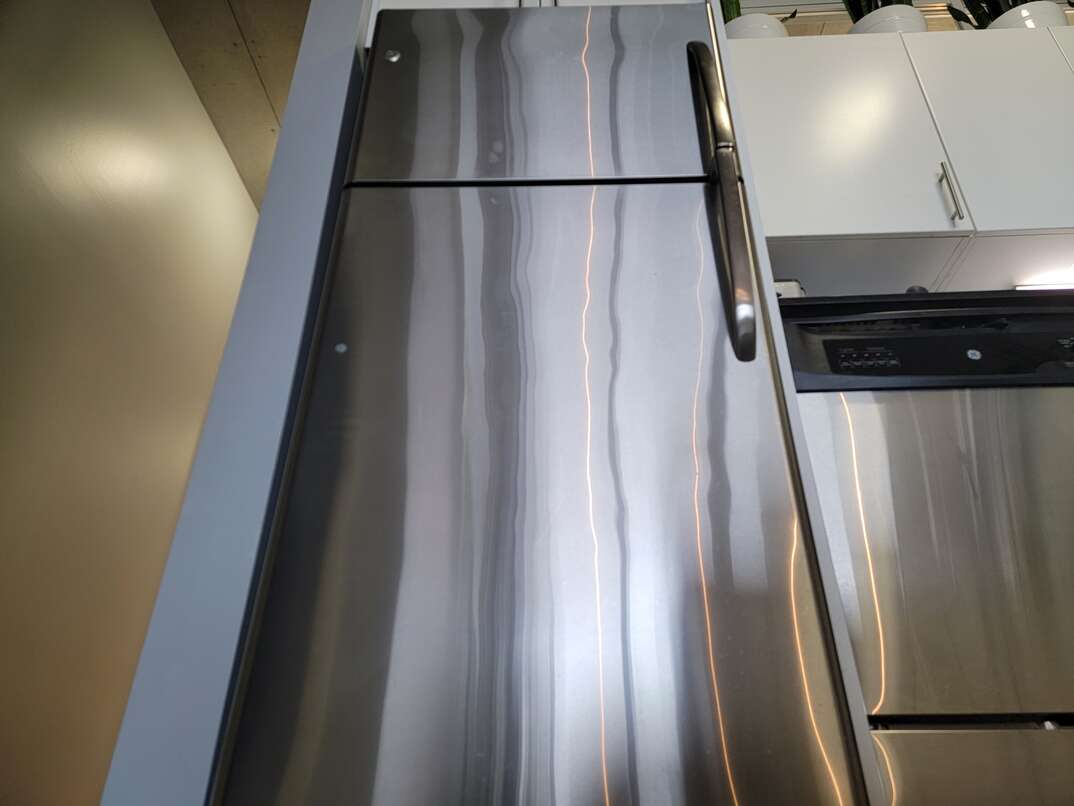 up view of a stainless steel fridge
