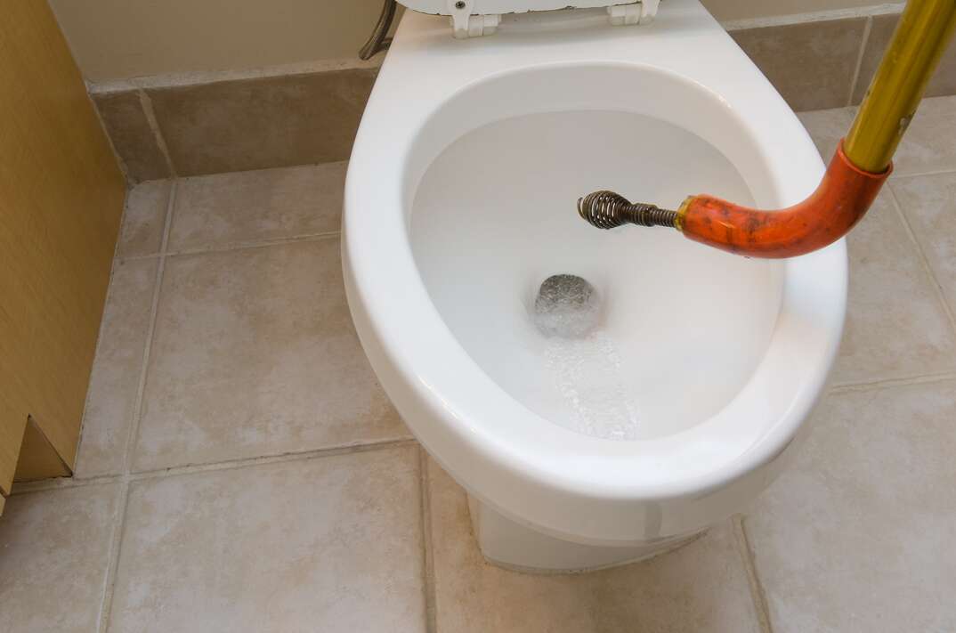 cleaning clog toilet