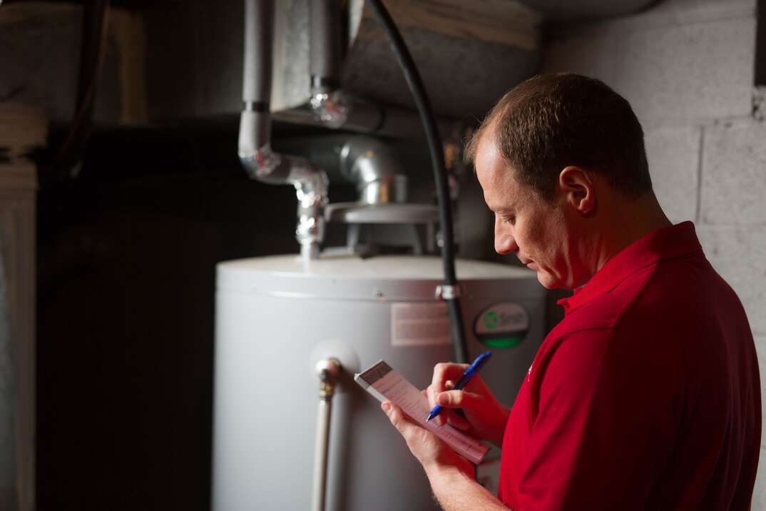 technician with water heater
