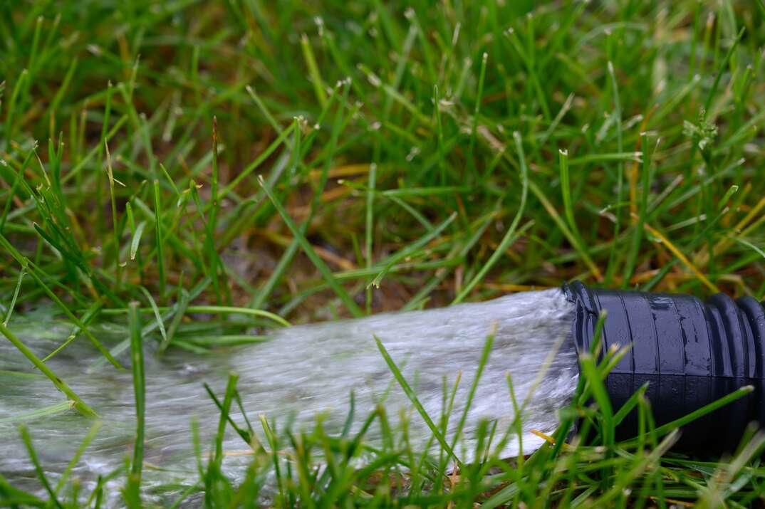 water gushing from drainage pipe