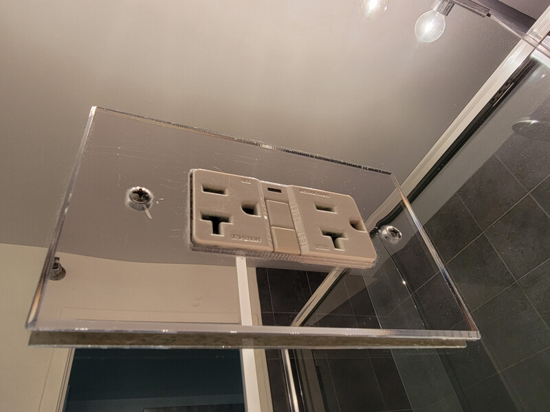 electrical outlet on glass wall