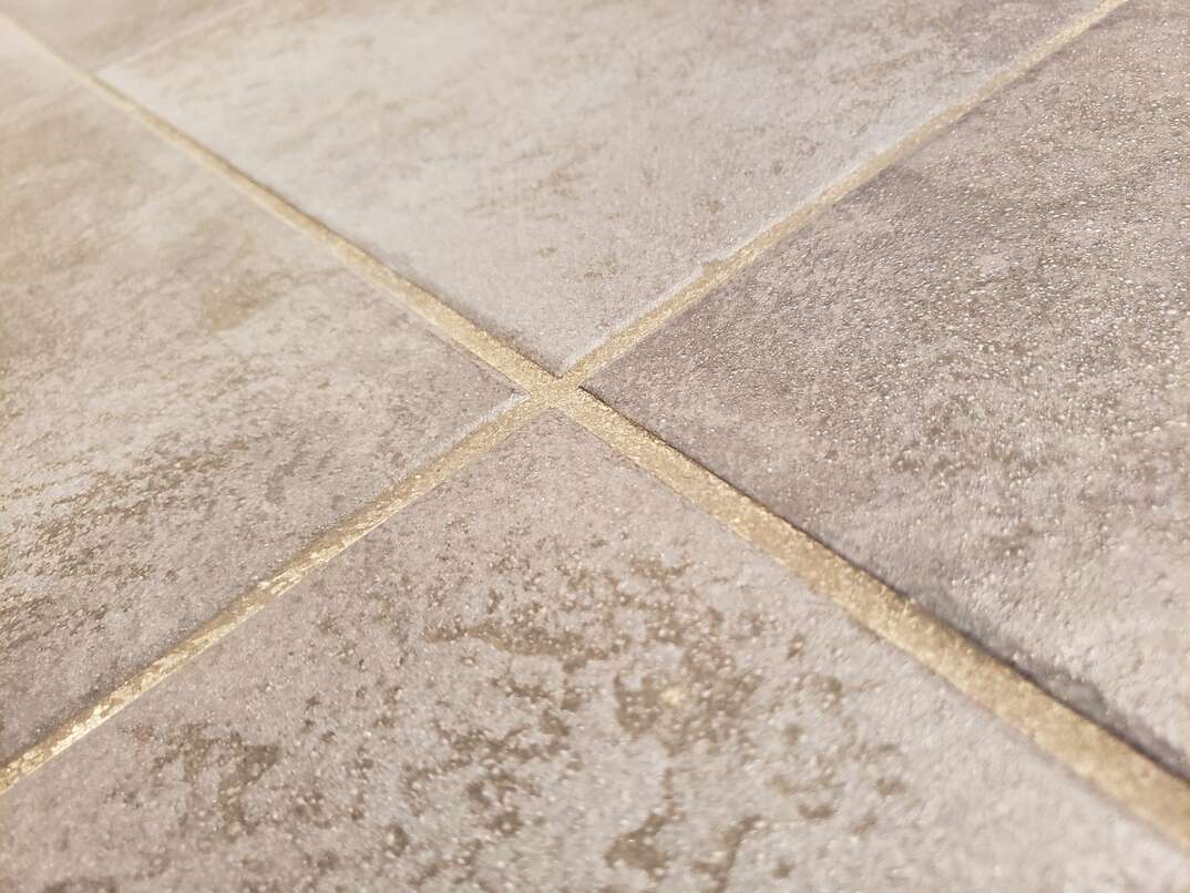 grout between tiles on the floor