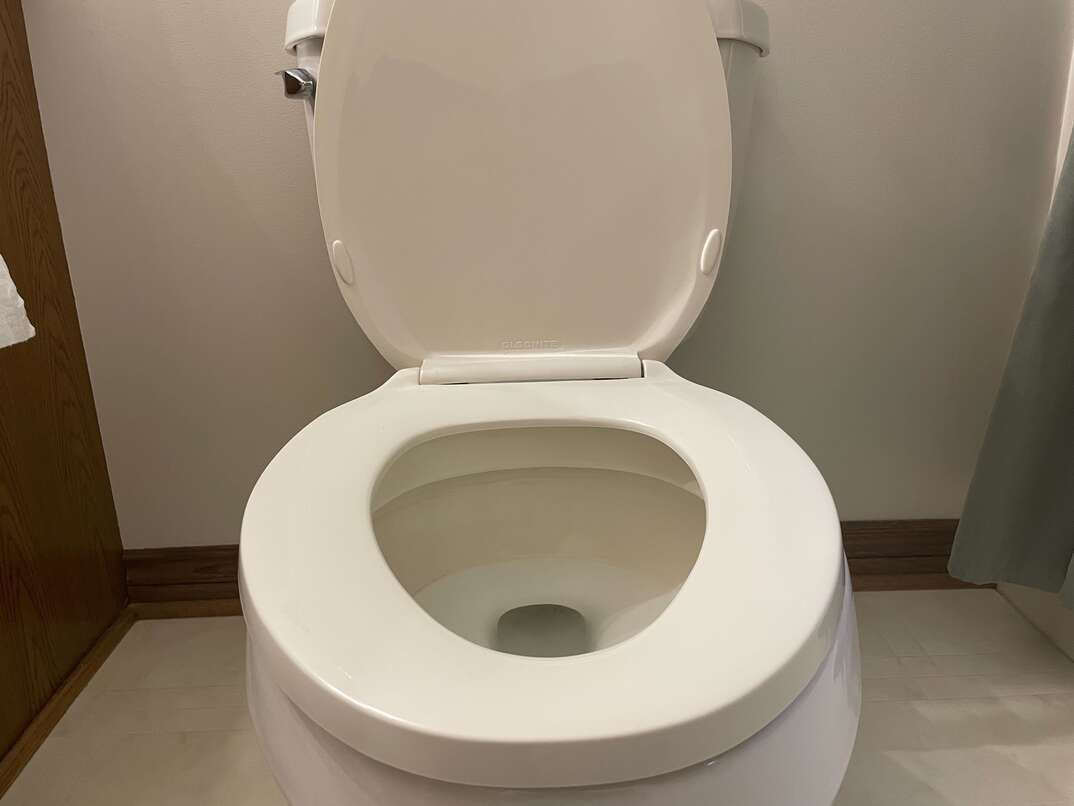 white open toilet in restroom