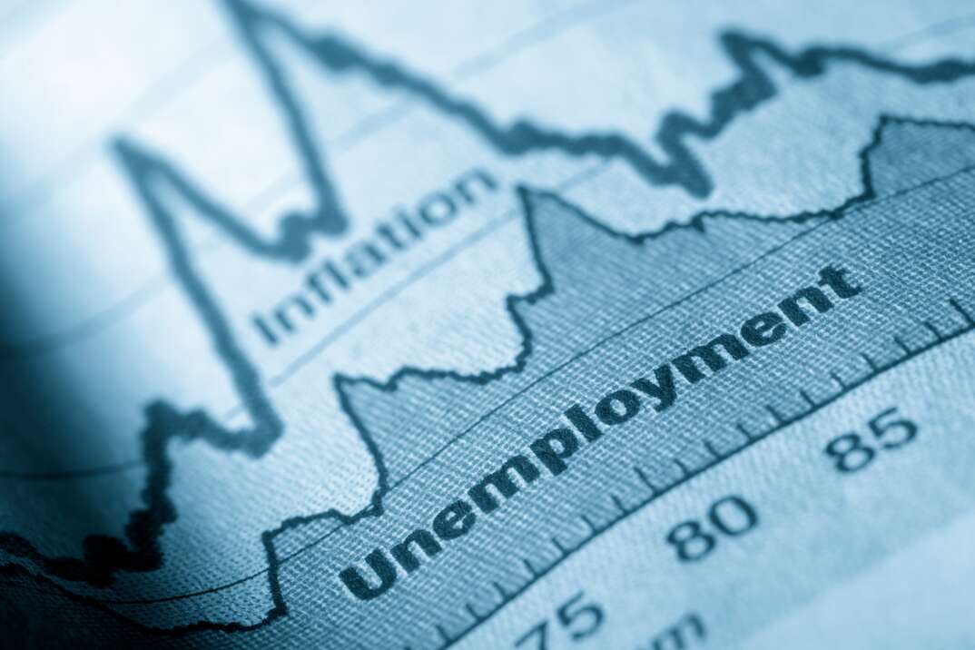 Business graph unemployment and inflation in newspapers