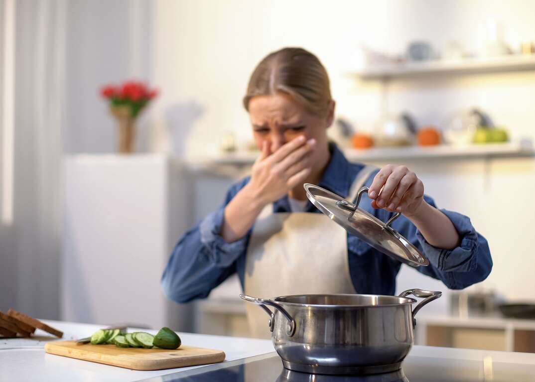 Woman cooking in kitchen