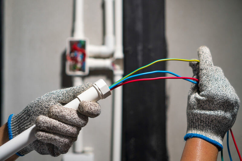 Many plugs plugged into electric power bar