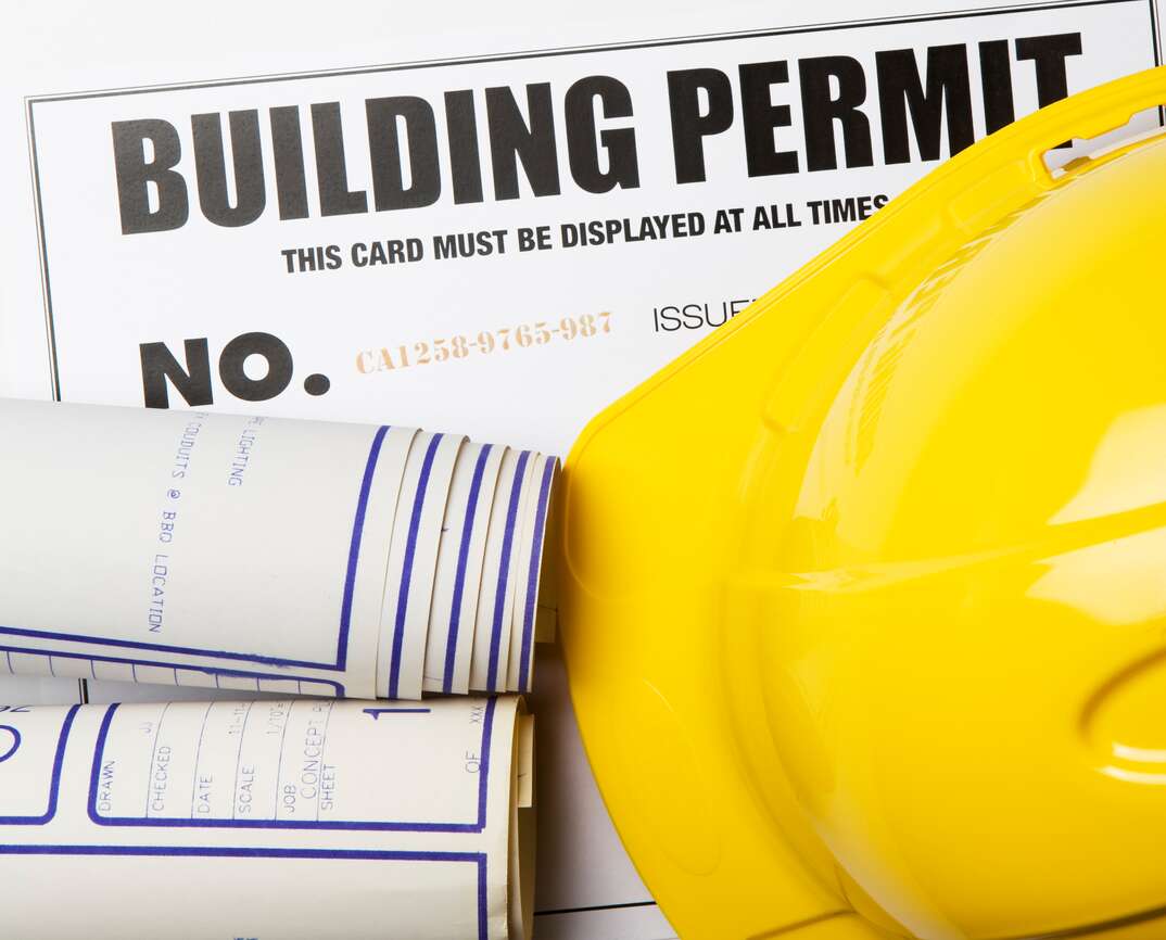 Building Permit - Construction Permit: with blueprints and hardhat