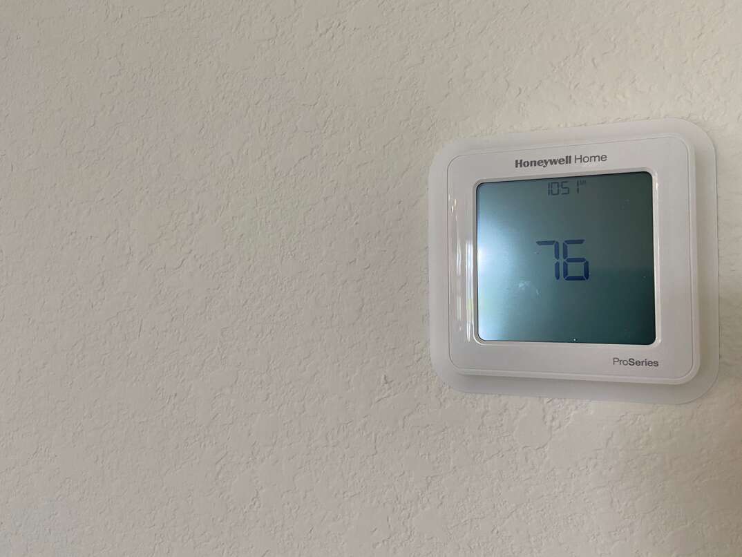 smart thermostat mounted on wall