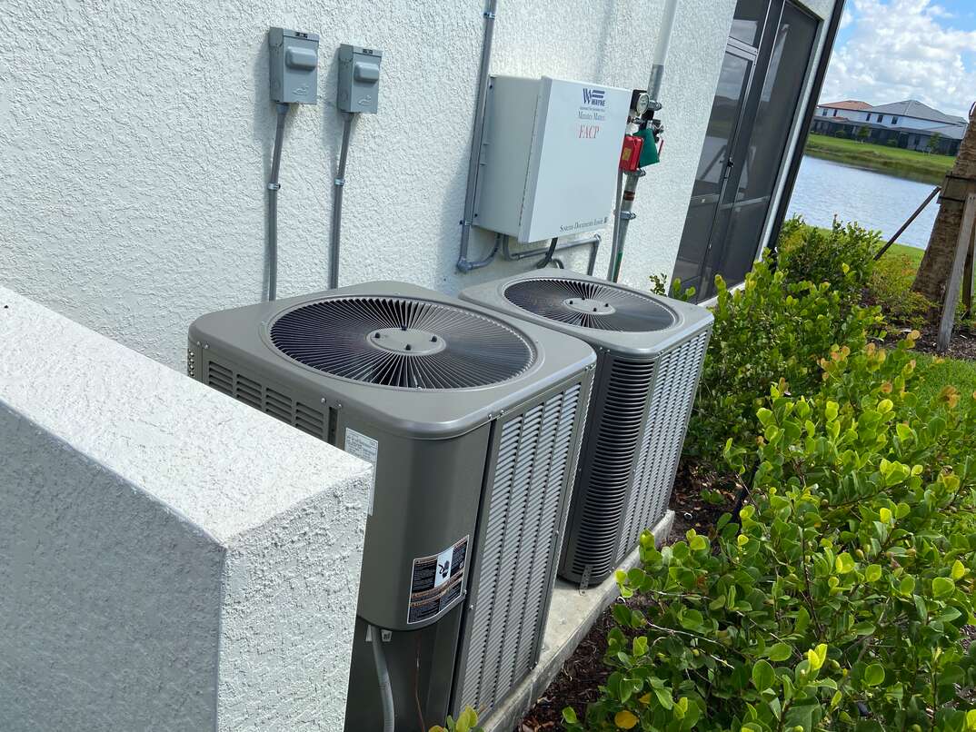dual ac condensers outside home