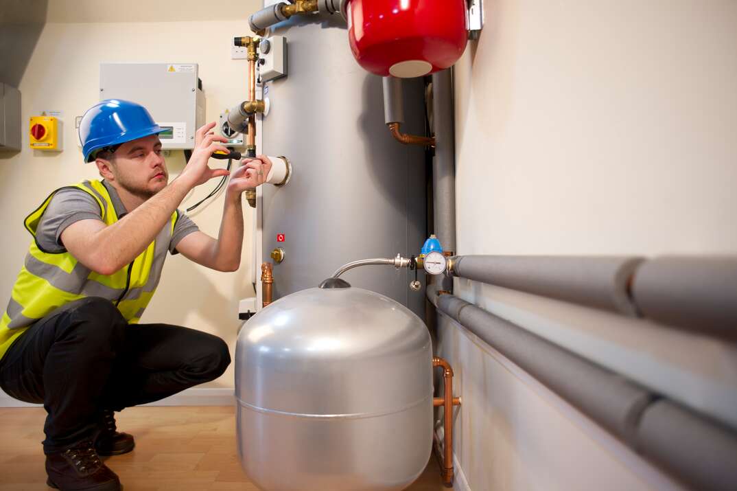 engineer checks solar pv control panel