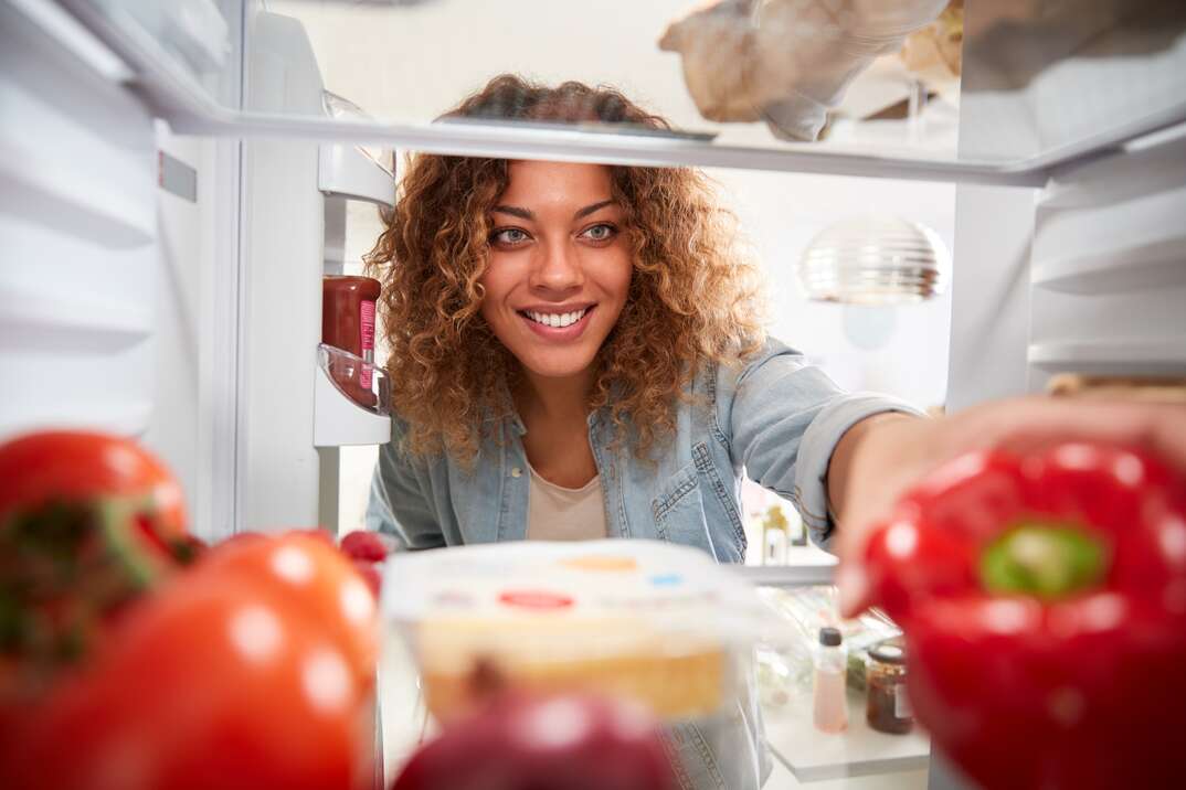 woman looking into the refrigerator