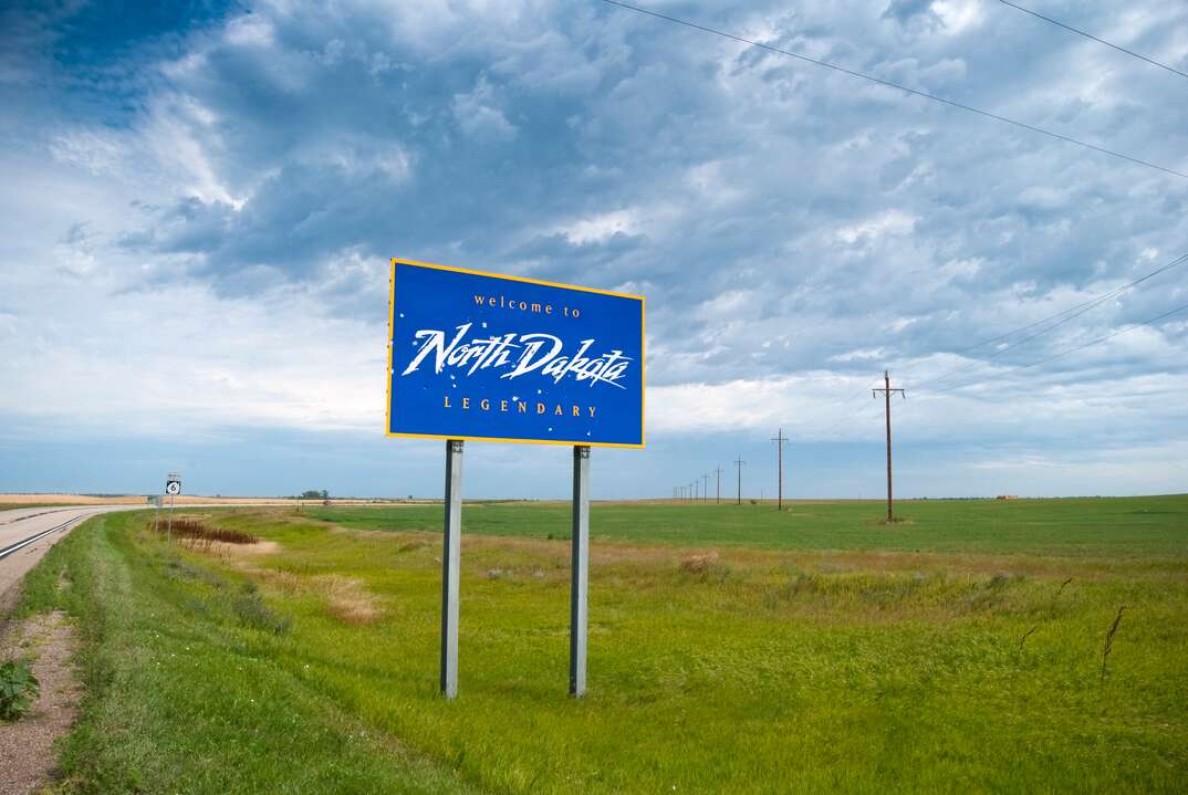 Welcome to North Dakota sits besides a highway 