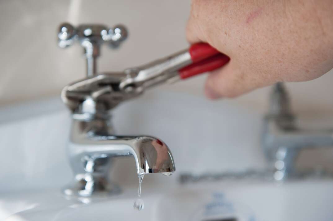 tightening faucet with wrench