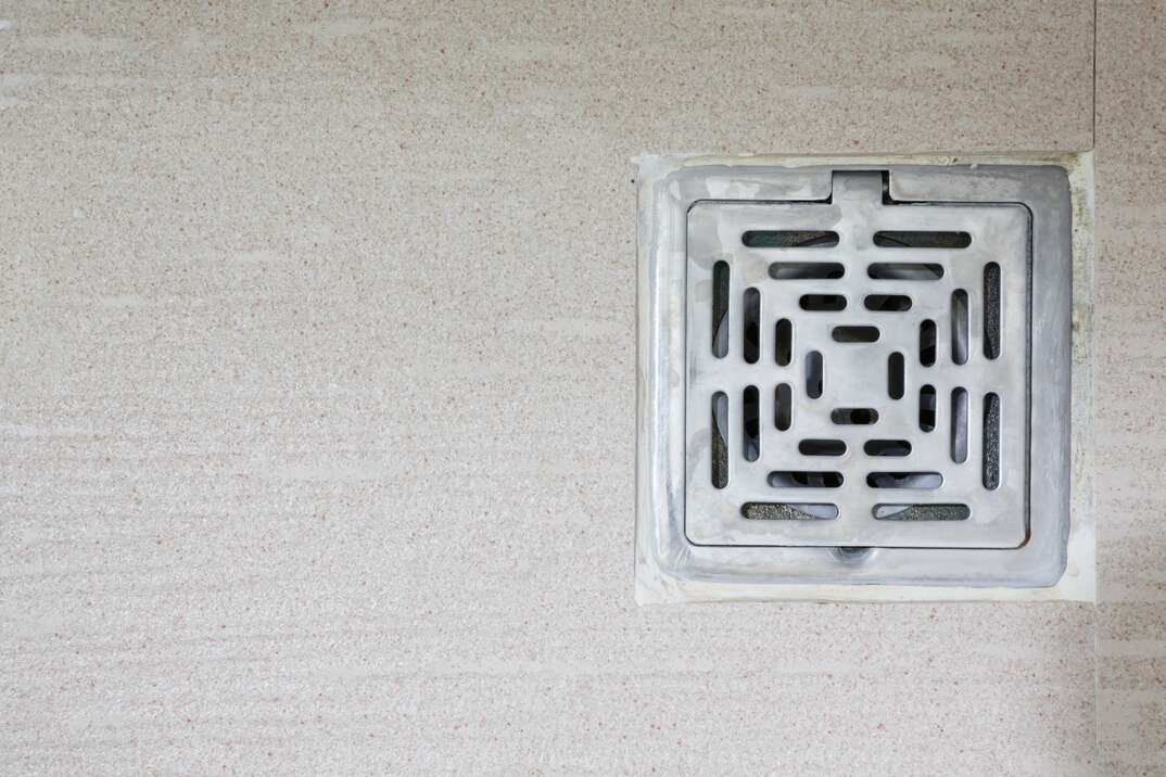 close up photo of a garage floor drain