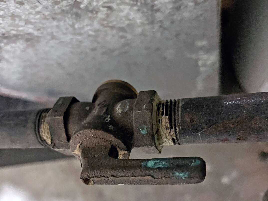 a close up of a residential gas line shutoff