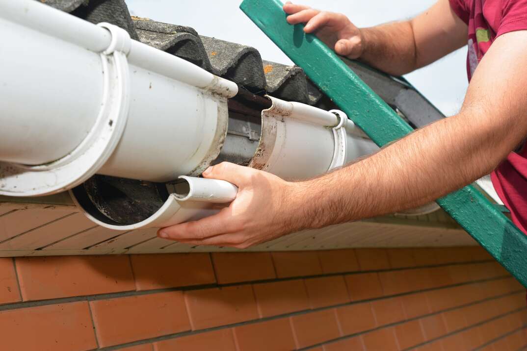 Guttering repair. Roofer contractor  repair rain gutter.