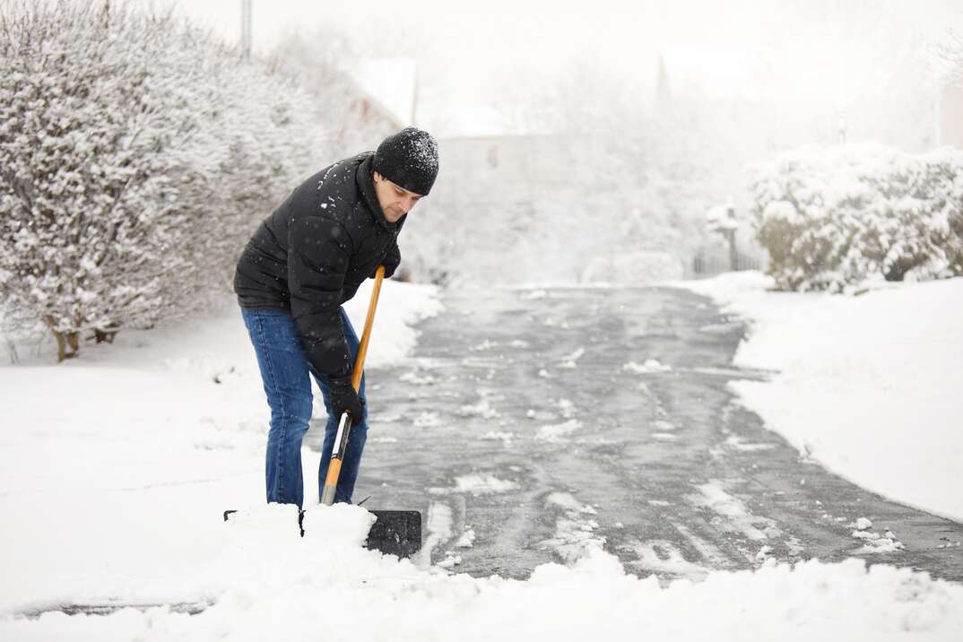 Shoveling Snow From The Driveway