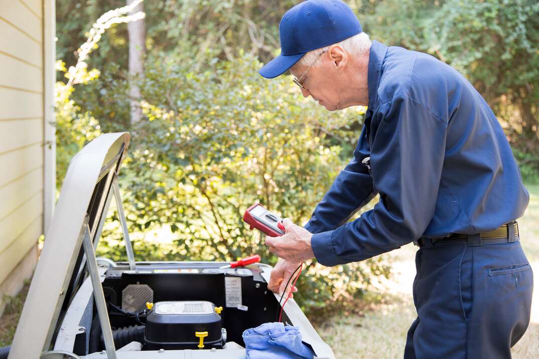 Technician services outside AC units and generator 