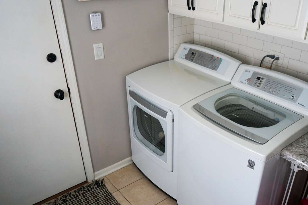 residential washer and dryer in laundry room