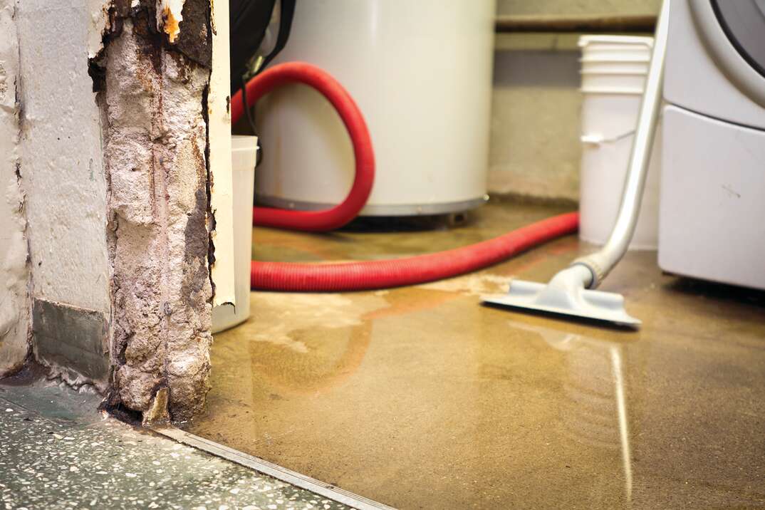 Significant flooding has damaged a basement. Narrow depth of field.