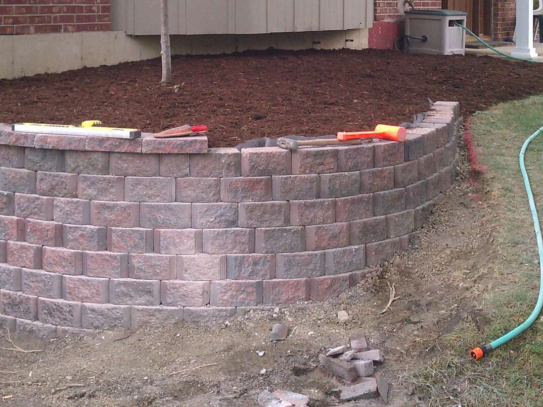 Retaining wall being built at the old Rossi house in the same area.