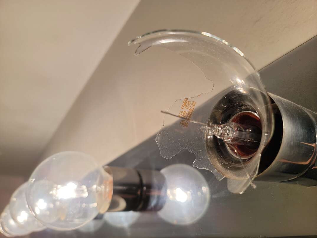 broken lightbulb in bathroom vanity
