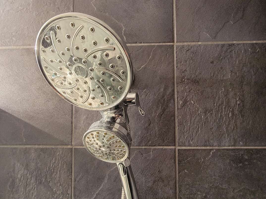 Showerhead with handheld sprayer