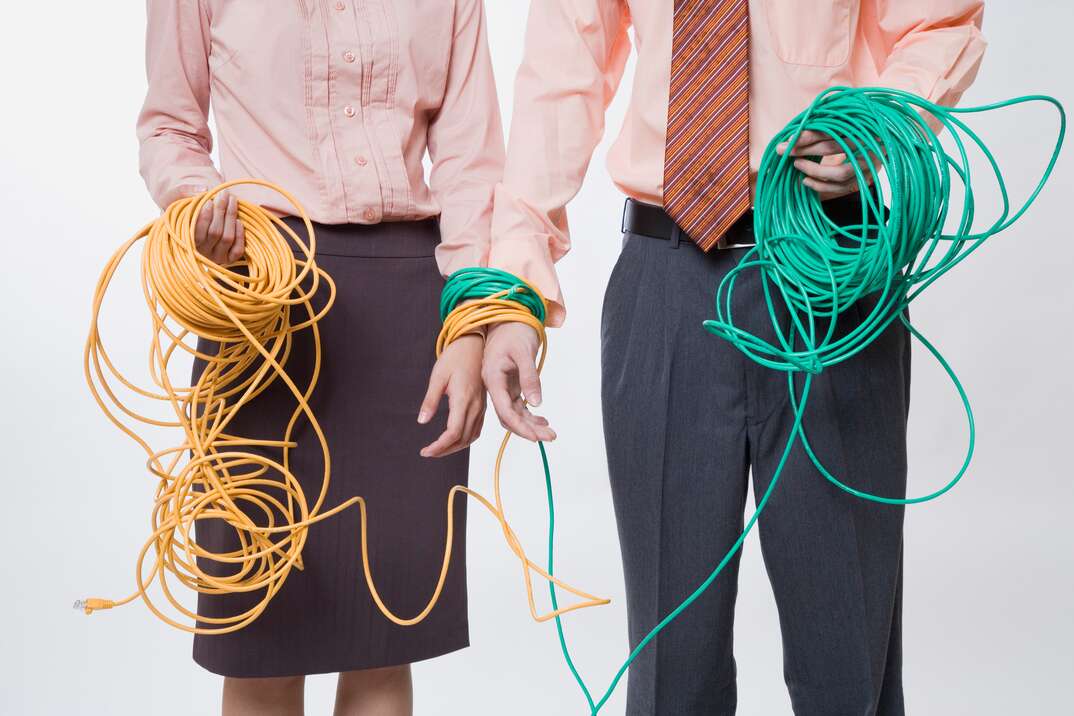 Workers bound by cables