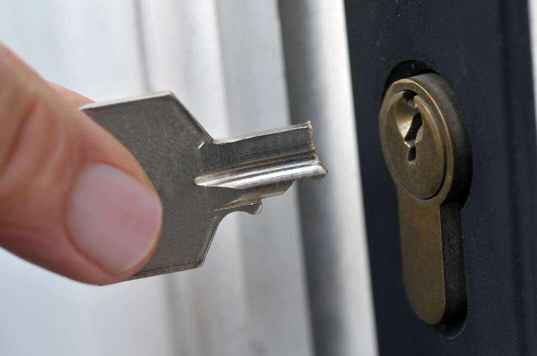 Broken key in front of a lock